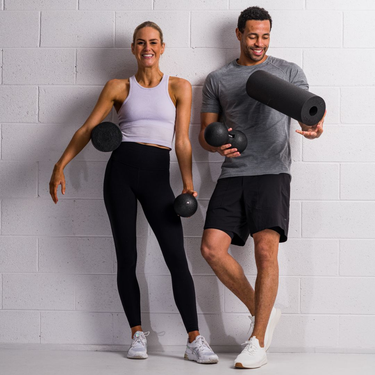 Man and woman enjoying fitness equipment
