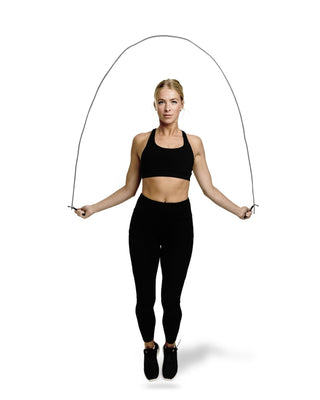 Woman training with a skipping rope