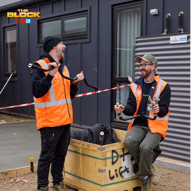 Mat and Robby from the block holding gym equipment