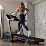 lady running on her home gym treadmill