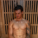 Man inside Regen8 Quadro Sauna