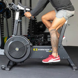 man riding home gym cardio equipment bike