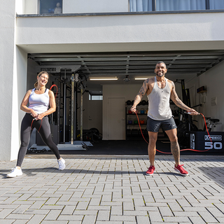 Crafting A Joyful Fitness Routine: Your Guide To Success Image 1 - woman and man in front of home gym.