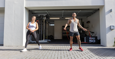 Crafting A Joyful Fitness Routine: Your Guide To Success Image 1 - woman and man in front of home gym.