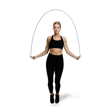 Woman training with a skipping rope