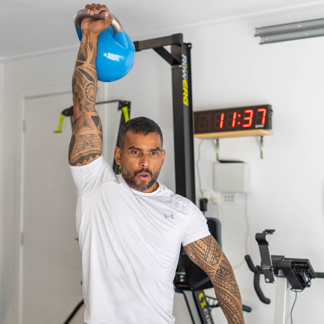 Man using Xpeed Kettle Bell for his strength training