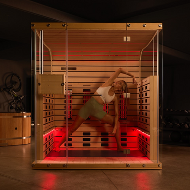 Woman doing yoga inside a Found Space Sauna