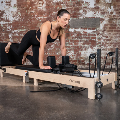 woman on a Pilates reformer 