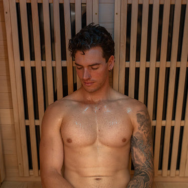 Man inside Regen8 Quadro Sauna