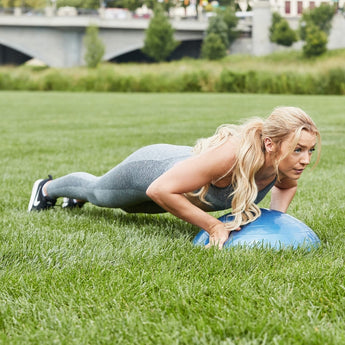 Female training with the Bosu Ball Sport Balance Trainer