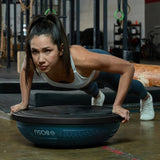 Female training with a Bosu Ball Home NEXGEN Balance Trainer